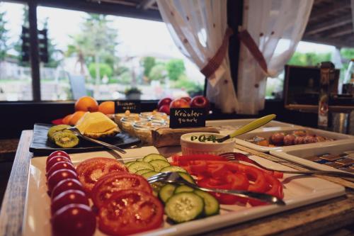 a table with many different types of food on it at Gasthaus Amboss in Ravensburg