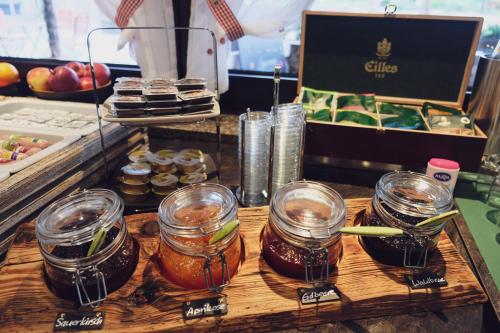 a table with jars of honey and other food at Gasthaus Amboss in Ravensburg