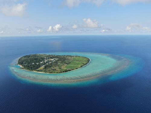 an island in the middle of the ocean at Thoddoo Island Life in Thoddoo
