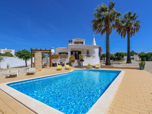 a villa with a swimming pool in front of a house at V3, Villa Belo Horizonte near Beach, Albufeira in Albufeira