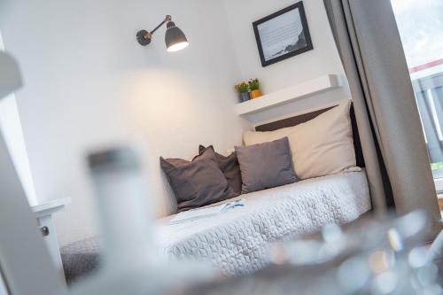 a mirror reflection of a bed in a room at Hotel Seehof in Zell am See