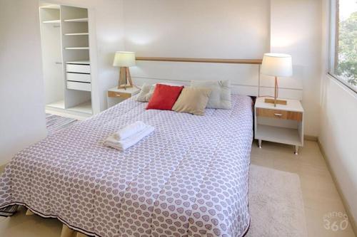 a bedroom with a large bed with two lamps on it at N2A2 - New, Nice, for Long and Short Stay in Asuncion