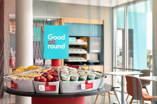 a display of food on a table in a store at avid hotel Lexington - Hamburg Area by IHG in Lexington