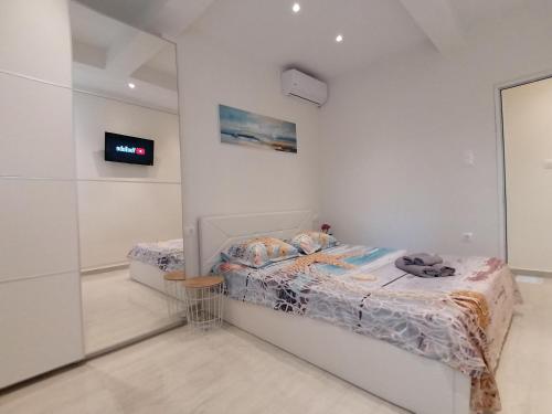 Postel nebo postele na pokoji v ubytování Sea Pleasure Apartment