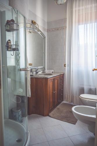 a bathroom with a shower and a sink and a toilet at La Borgata in La Spezia