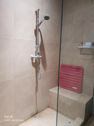 a shower with a shower head in a bathroom at Kenz Mehdia Beach Residence Touristique 50m de la Plage in Kenitra