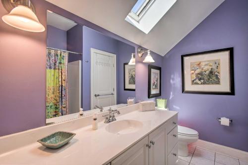 a purple bathroom with a sink and a toilet at Traditional Marthas Vineyard Home with Porch and Yard in Oak Bluffs
