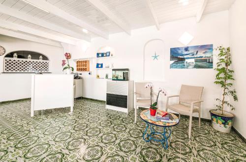 an office with a table and chairs in a room at Hotel Cava Dell'Isola in Ischia