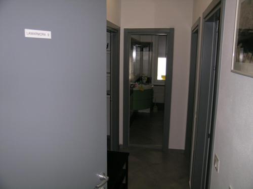a hallway with a door leading to a bathroom at lamarmora9 in La Spezia