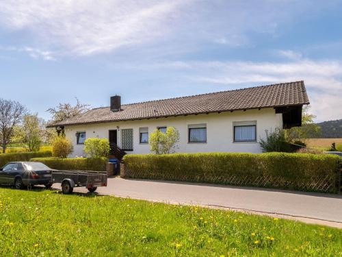 a truck parked in front of a house at Quaint Holiday Home in Bad K tzting with Garden Terrace in Bad Koetzting