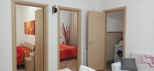 Posteľ alebo postele v izbe v ubytovaní ALLOGGIO TURISTICO IL RIFUGIO IN FIUMICINO