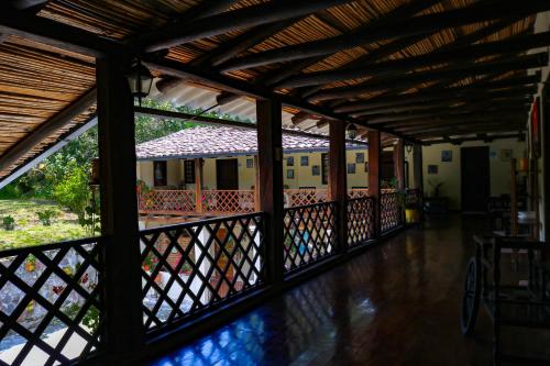 a view from the inside of a house with a fence at Hacienda San Isidro Trails & Experiences in Cotacachi