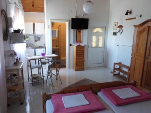 a living room with a couch and a table at Studio Apartment in Nin with Terrace, Air Conditioning, Wi-Fi (233-2) in Nin