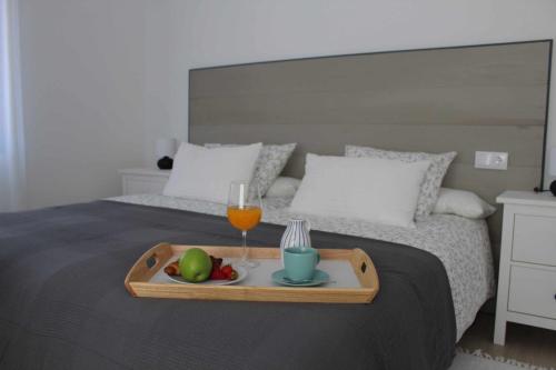 A bed or beds in a room at Viviendas turísticas San Juan