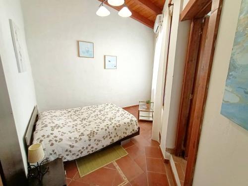 a small bedroom with a bed in a room at Apartamento Aymara de StarApsTenerife in Sauzal
