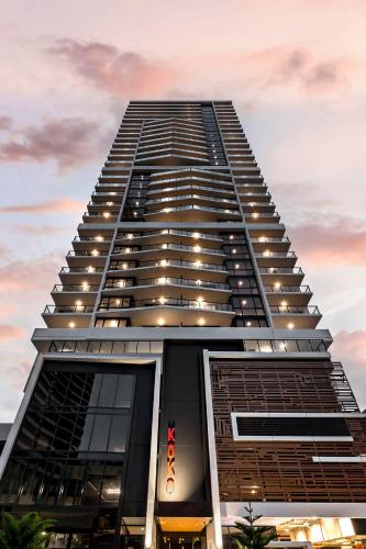 a tall building with lights on top of it at Koko Broadbeach in Gold Coast