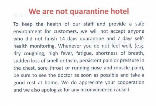 a page of a document with the words we are not quarantine holder at Colors Infinity Inn in Taipei
