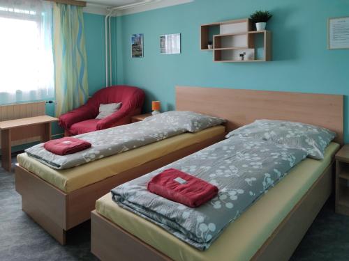 Postel nebo postele na pokoji v ubytování Penzion Na Výsluní