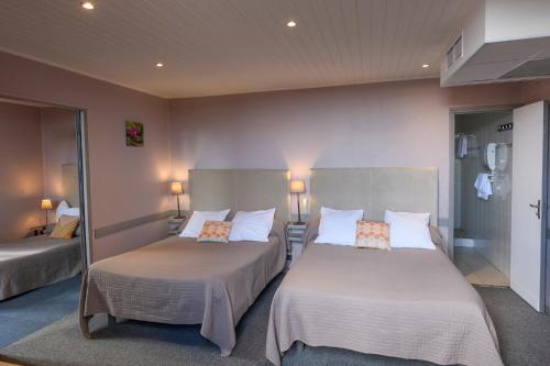 Postel nebo postele na pokoji v ubytování Hotel de l'Europe