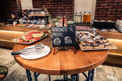 a wooden table with food on top of it at Penzion U Hada in Velké Pavlovice