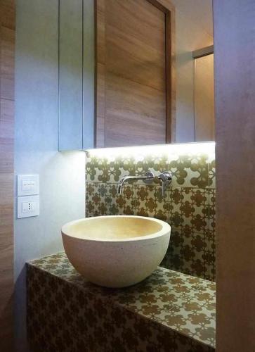 a large bowl sink on a counter in a bathroom at Molino dei Ciliegi - Splendida villa in Umbria in San Venanzo