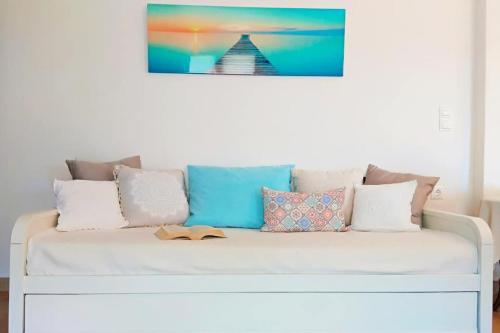 a white couch with pillows on top of it at Like home in Philotium