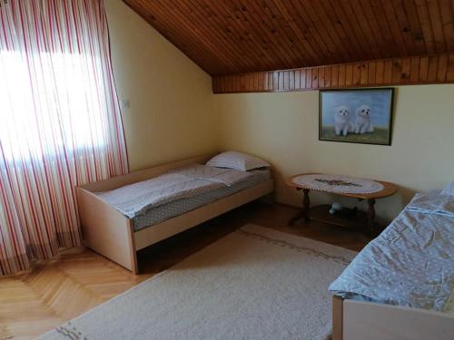 Postel nebo postele na pokoji v ubytování Kuća Marić Mačkat