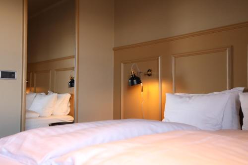 Postel nebo postele na pokoji v ubytování Hotel Akureyri