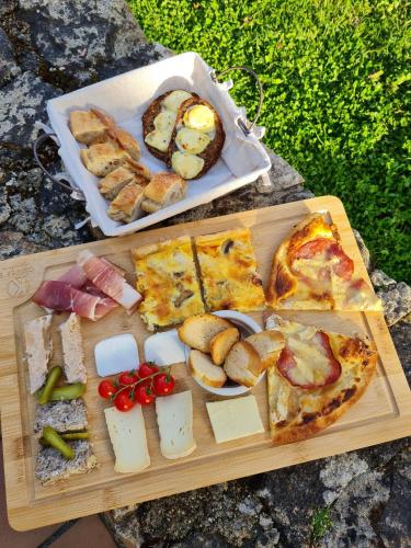 a tray of pizza and other food on a table at Gîte "Tahiti", parking securise in La Roche-sur-Yon