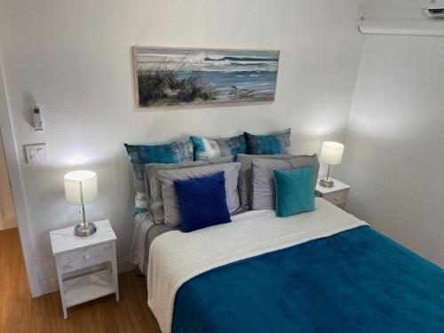 En eller flere senge i et værelse på Mermaid's Cottage