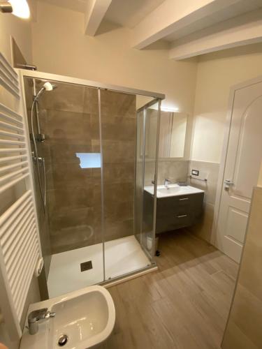 a bathroom with a shower and a sink at Garden Lodge in Stresa