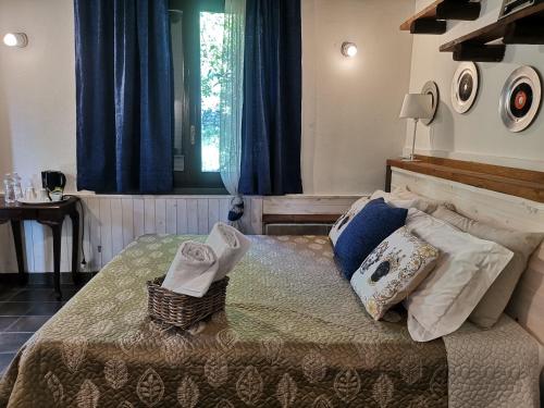 A bed or beds in a room at La Fattoria Dei Nonni