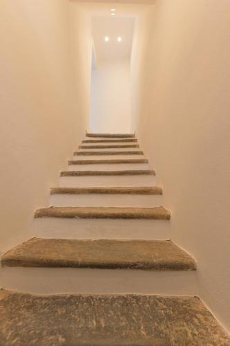 a set of stairs in a room with a hallway at Casa CarMa in Porto Ceresio
