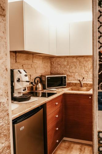 Η κουζίνα ή μικρή κουζίνα στο Pietraluna luxury b&b