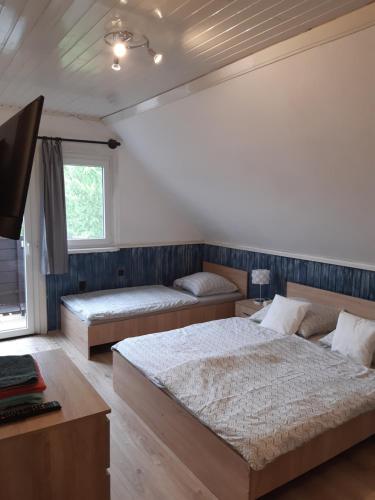 Llit o llits en una habitació de Villa Suzy