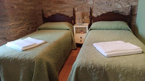 Postel nebo postele na pokoji v ubytování Casa Santiago