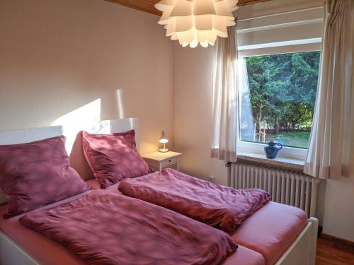 Postel nebo postele na pokoji v ubytování Haus Schneverdingen