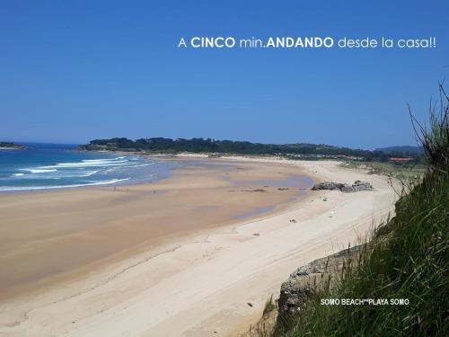 a view of a beach with people on the sand at "LAS CAMELIAS SOMO" un lugar para desconectar!! Vistas al MAR!! in Somo