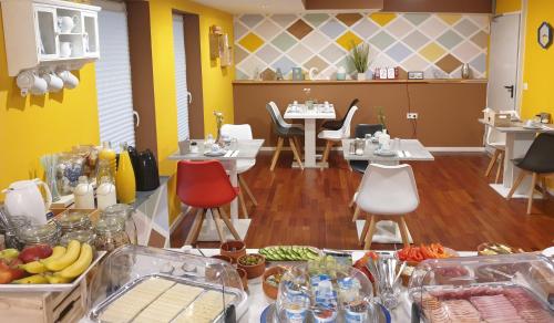 a restaurant with a table with food on it at Oleander Hof in Hochstadt