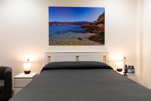 Ένα ή περισσότερα κρεβάτια σε δωμάτιο στο Innmare Fortuna Hotel Dos Estrellas