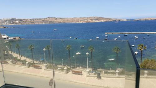 a view of a harbor with boats in the water at Flat 2 Blue Waves in St Paul's Bay