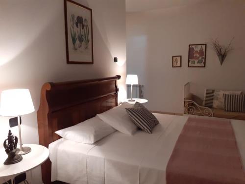 En eller flere senge i et værelse på Stella d'Italia