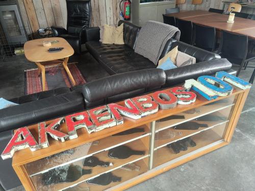 a black leather couch sitting on top of a table at Akrenbos 101 in Bever
