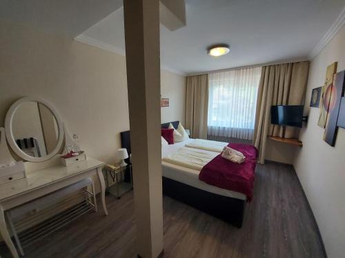Postel nebo postele na pokoji v ubytování Hotel Kirchenwirt