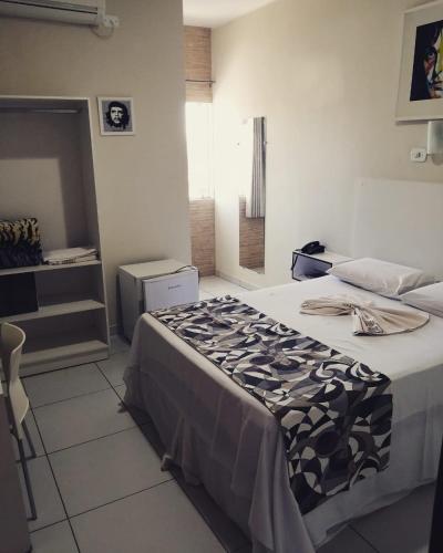 Ένα ή περισσότερα κρεβάτια σε δωμάτιο στο Nuna Hotel