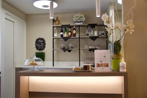 a counter with a light in a room at Green Class Hotel Gran Torino in Turin