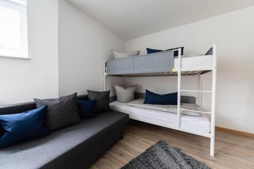 a living room with a bunk bed and a couch at Ferienwohnung - Auszeit im Schwarzwald in Schwanau