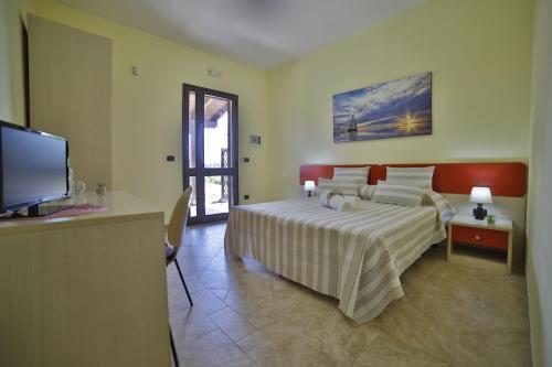 Ein Bett oder Betten in einem Zimmer der Unterkunft B&B La Casa di Attilio