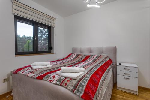 Ένα ή περισσότερα κρεβάτια σε δωμάτιο στο Apartman Bonita