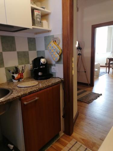 a kitchen with a sink and a counter top at la casetta in Sassari